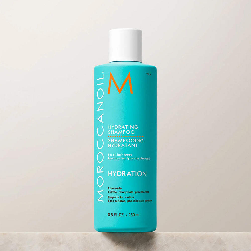 Turquoise bottle of Moroccanoil Hydrating Shampoo; color-safe moisturizing shampoo for all hair types; sulfate, phosphate, and paraben-free, 8.5 fl oz.