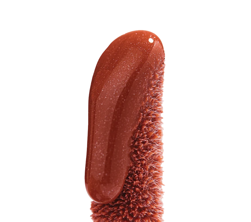 Close up of Ourself Lip Conditioner wand in shade Sunset (shimmering rose nude).