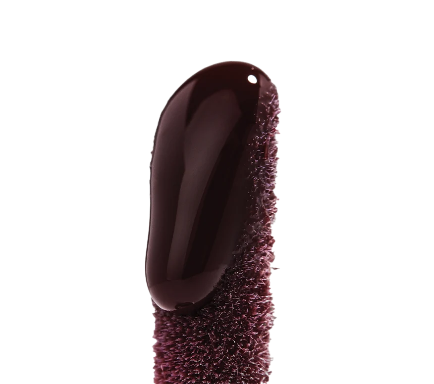 Close up of Ourself Lip Conditioner wand in shade Berry (deep mauve).