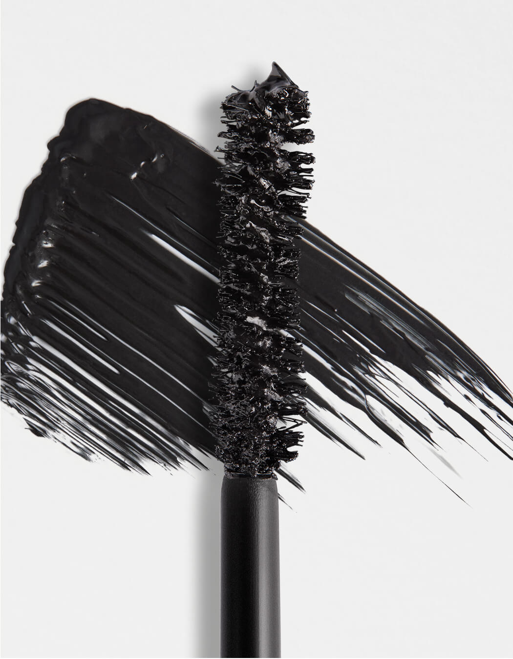Close up swatch of black RevitaLash Volumizing Mascara. 