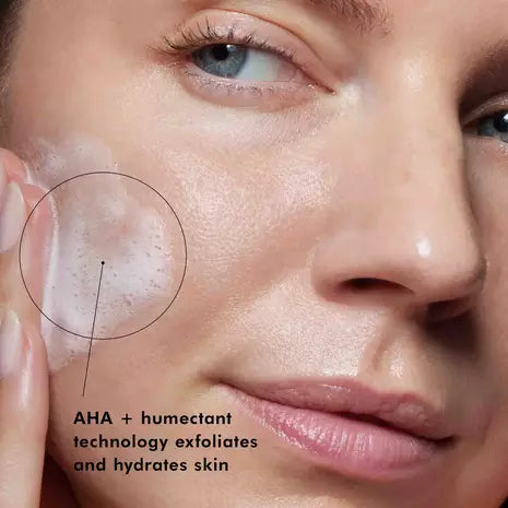 Close up of woman with healthy-looking skin applying SkinCeuticals Purifying Cleanser with AHA and humectant technology to exfoliate and hydrate skin. 
