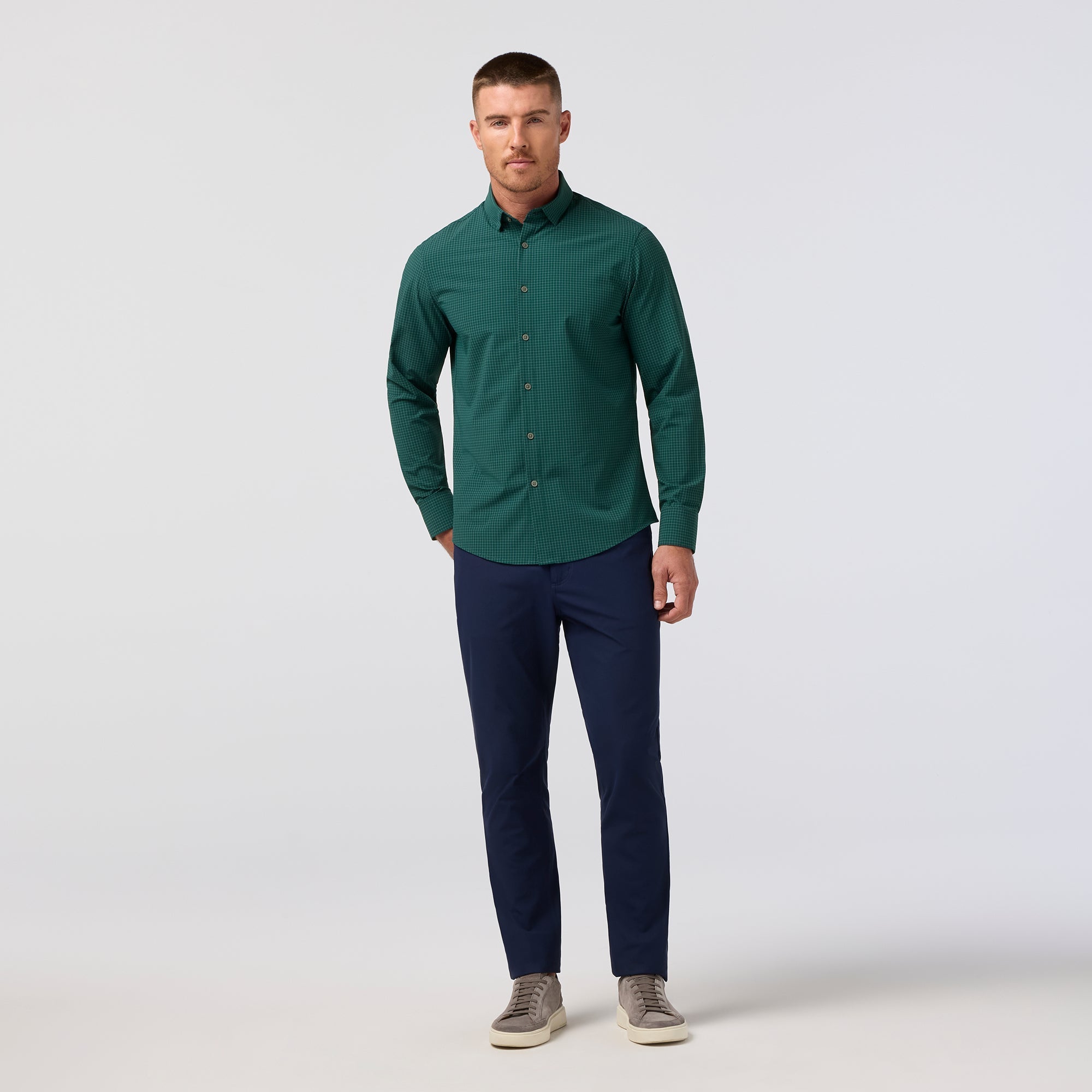 Model wearing the Mizzen+Main Leeward Long Sleeve Dress Shirt (Trim Fit) in Dark Sea Noah Tattersall (deep teal and white check), showing the tailored fit and spread collar.