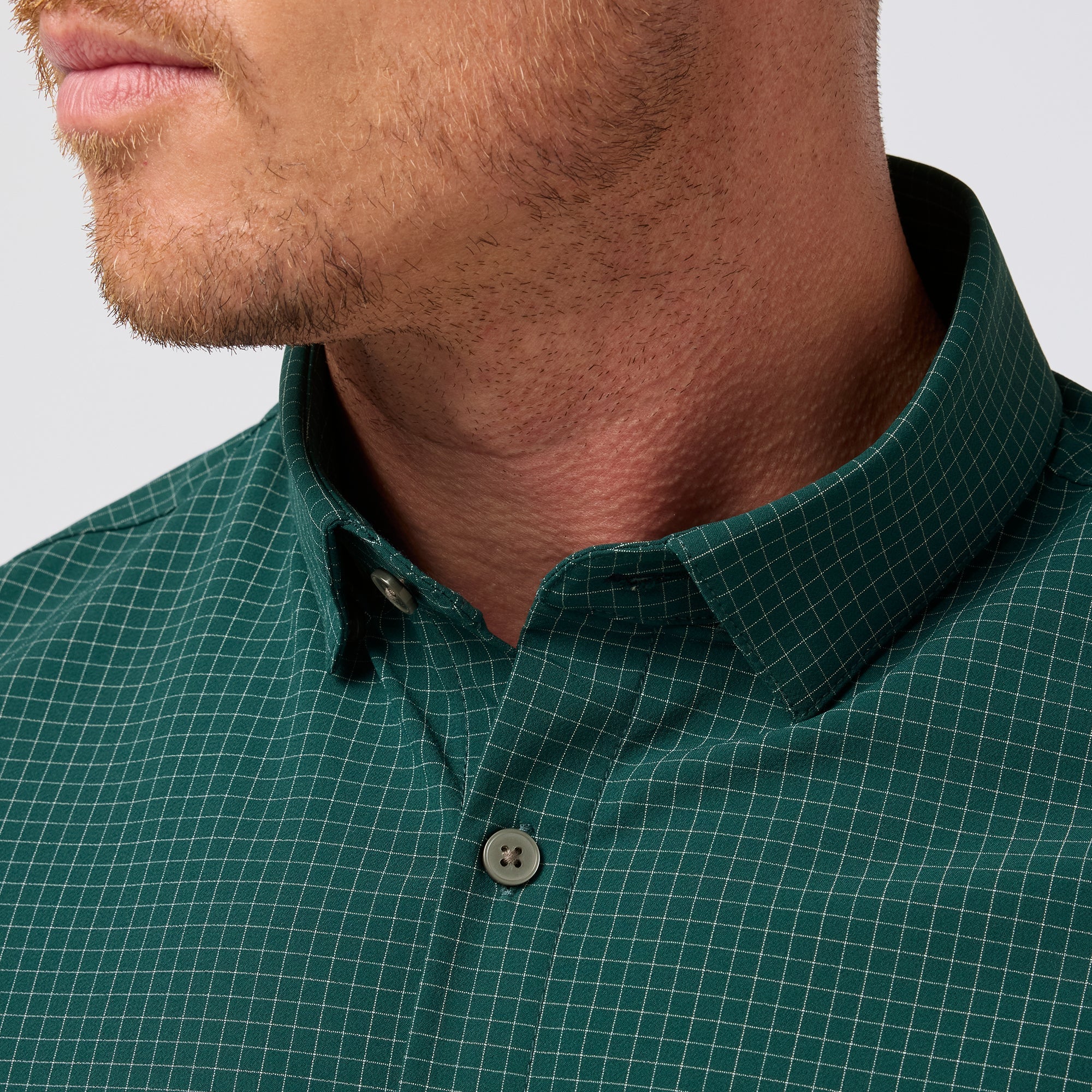 Close-up of the spread collar and neckline on the Mizzen+Main Leeward Long Sleeve Dress Shirt in Dark Sea Noah Tattersall (deep teal and white check).
