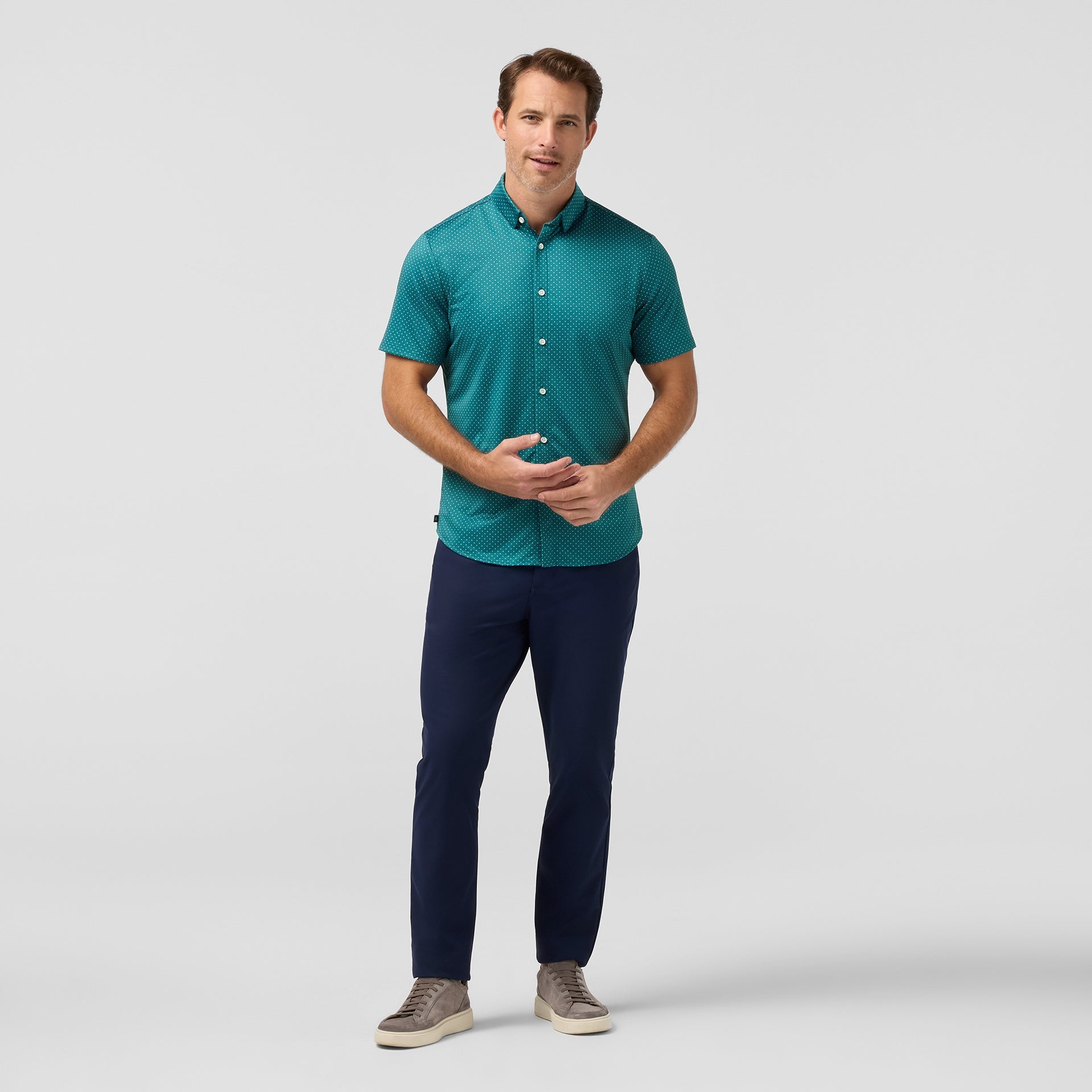Model wearing the Mizzen+Main Short Sleeve Dress Shirt in Dark Teal Dot, showing the fit and short sleeves.