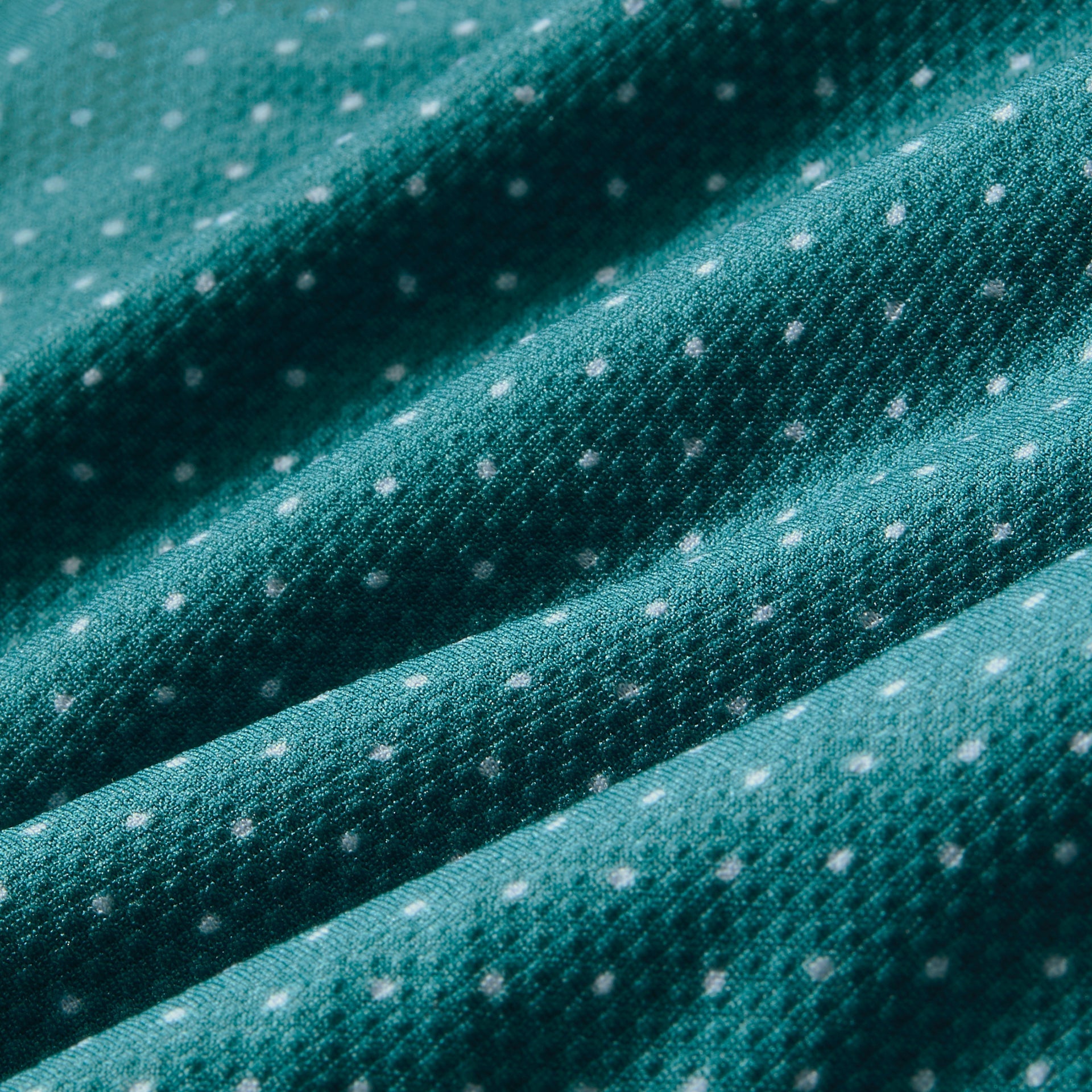 Fabric swatch of the Mizzen+Main Short Sleeve Dress Shirt in Dark Teal Dot, showing the dark teal and white dot pattern.