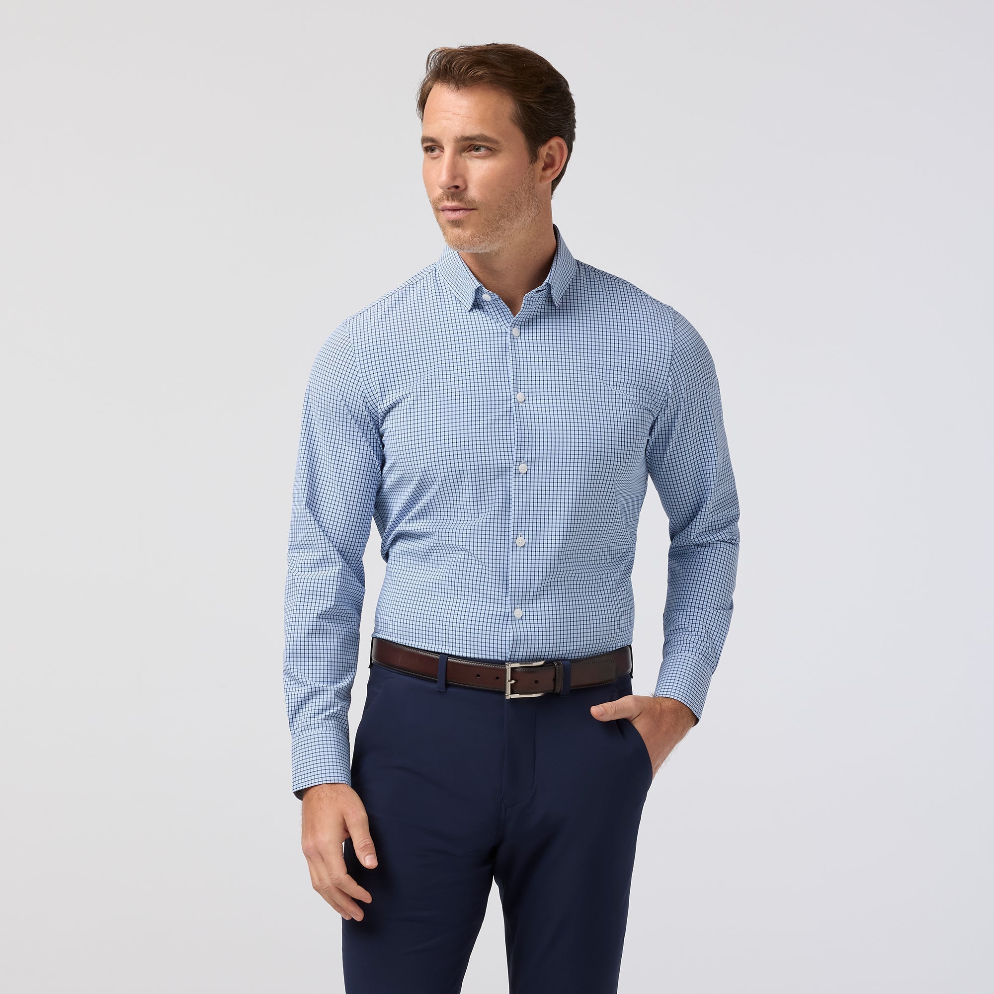 Front view of the Mizzen+Main Leeward Long Sleeve Dress Shirt (Trim Fit) in Midnight Navy Sam Plaid (dark navy and blue plaid), highlighting the plaid pattern and spread collar.