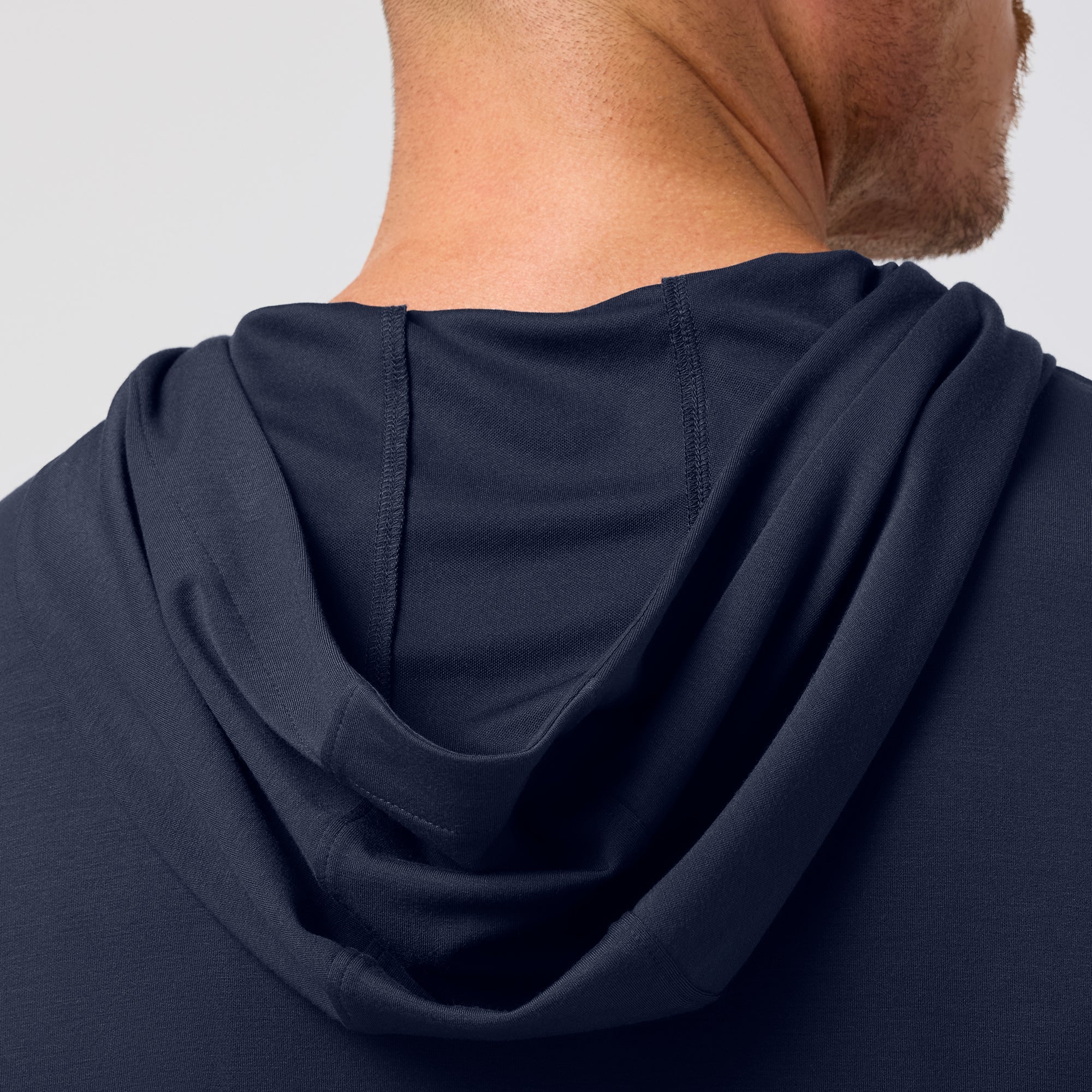 Close-up of the back of the Mizzen+Main Knox Hoodie in Navy, showing the attached hood.