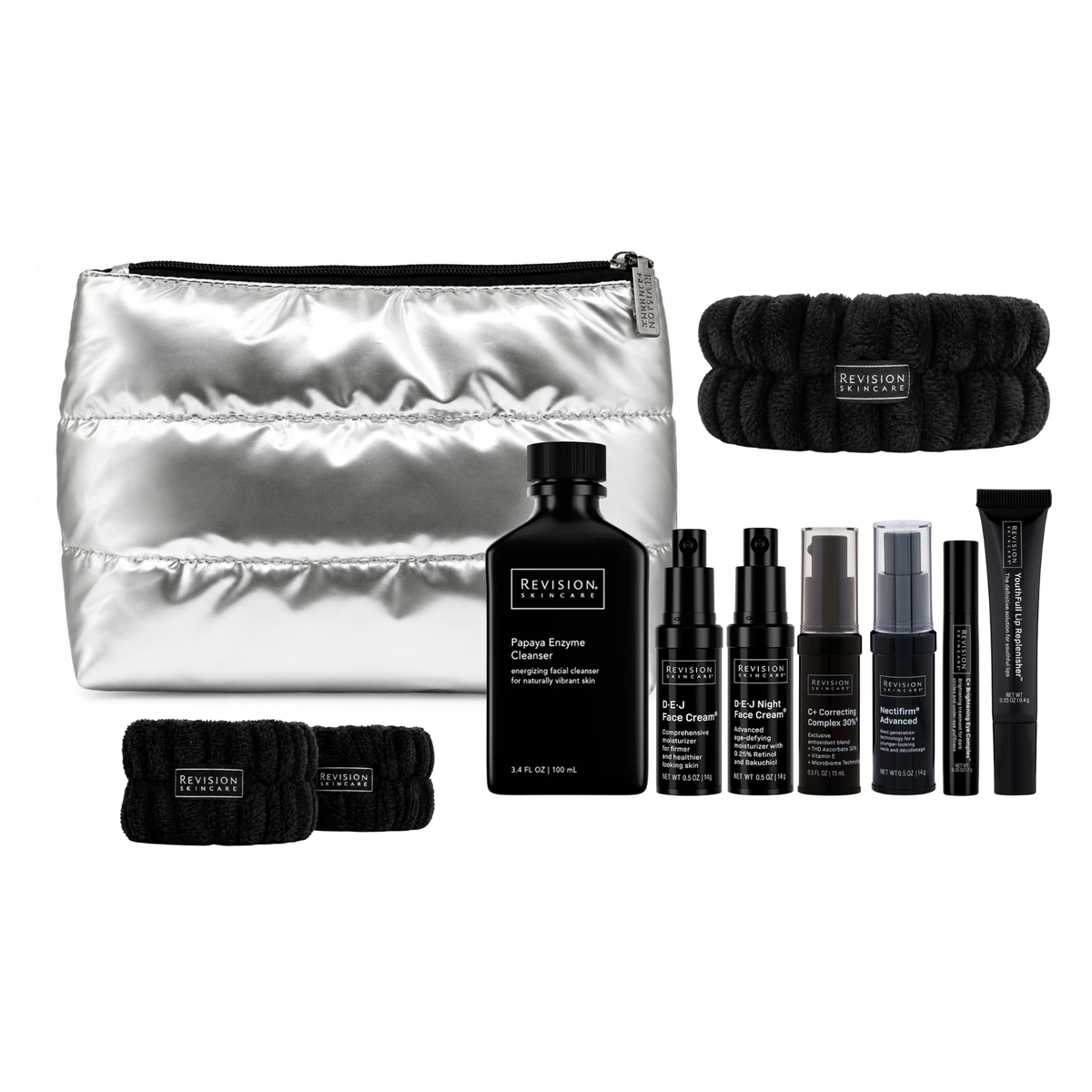Travel size Revision Skincare Ritual Set including Papaya Enzyme Cleanser, DEJ Face Cream, DEJ Night Face Cream, C+ Correcting Complex 30%, Nectifirm Advanced, C+ Brightening Eye Complex, Youthfull Lip Replenisher, Silver Puffy Makeup Bag, Headband, and Wrist Bands.
