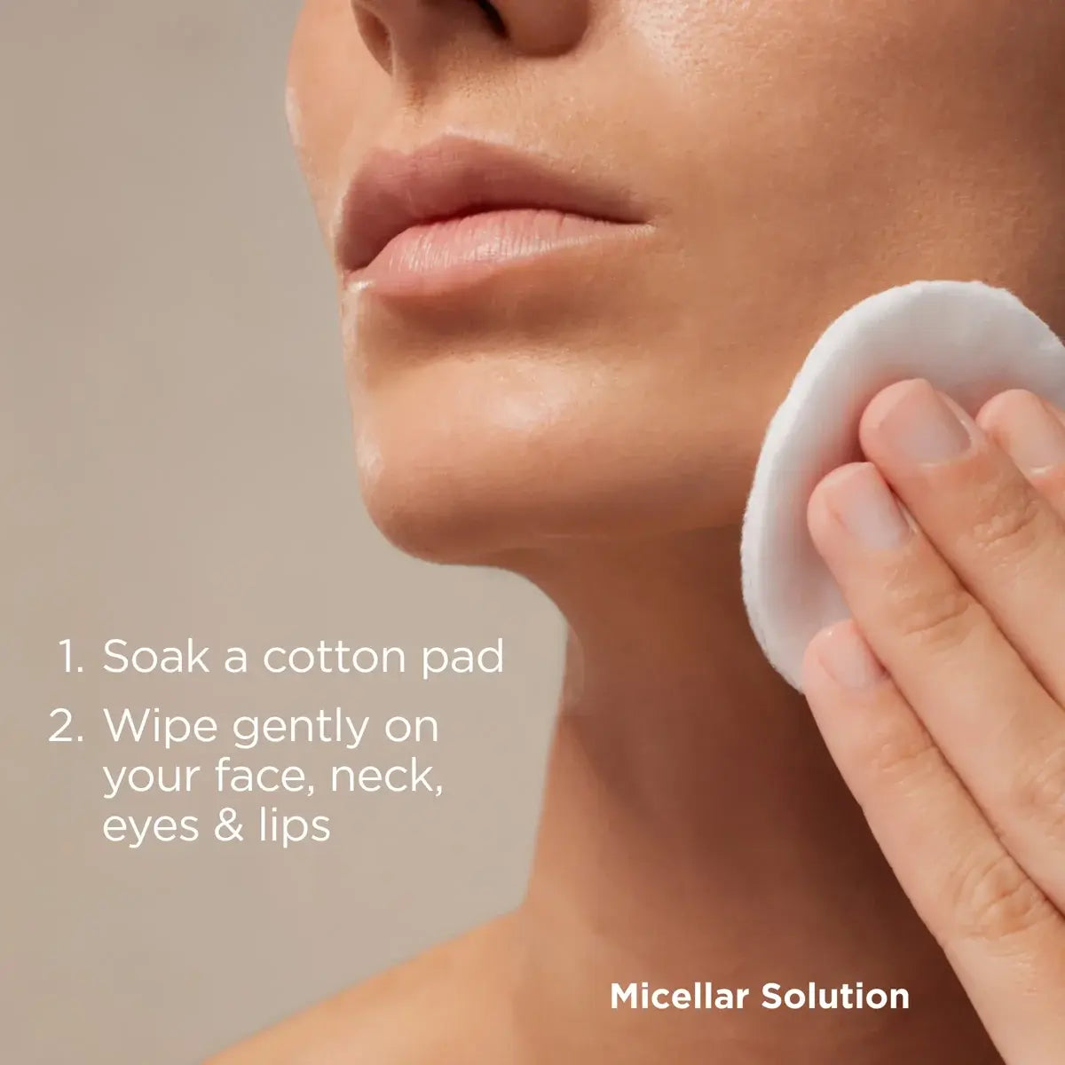 Close up of woman demonstrating soaking a cotton pad and gently wiping on face, neck, eyes, and lips to apply ISDIN Micellar Solution. 