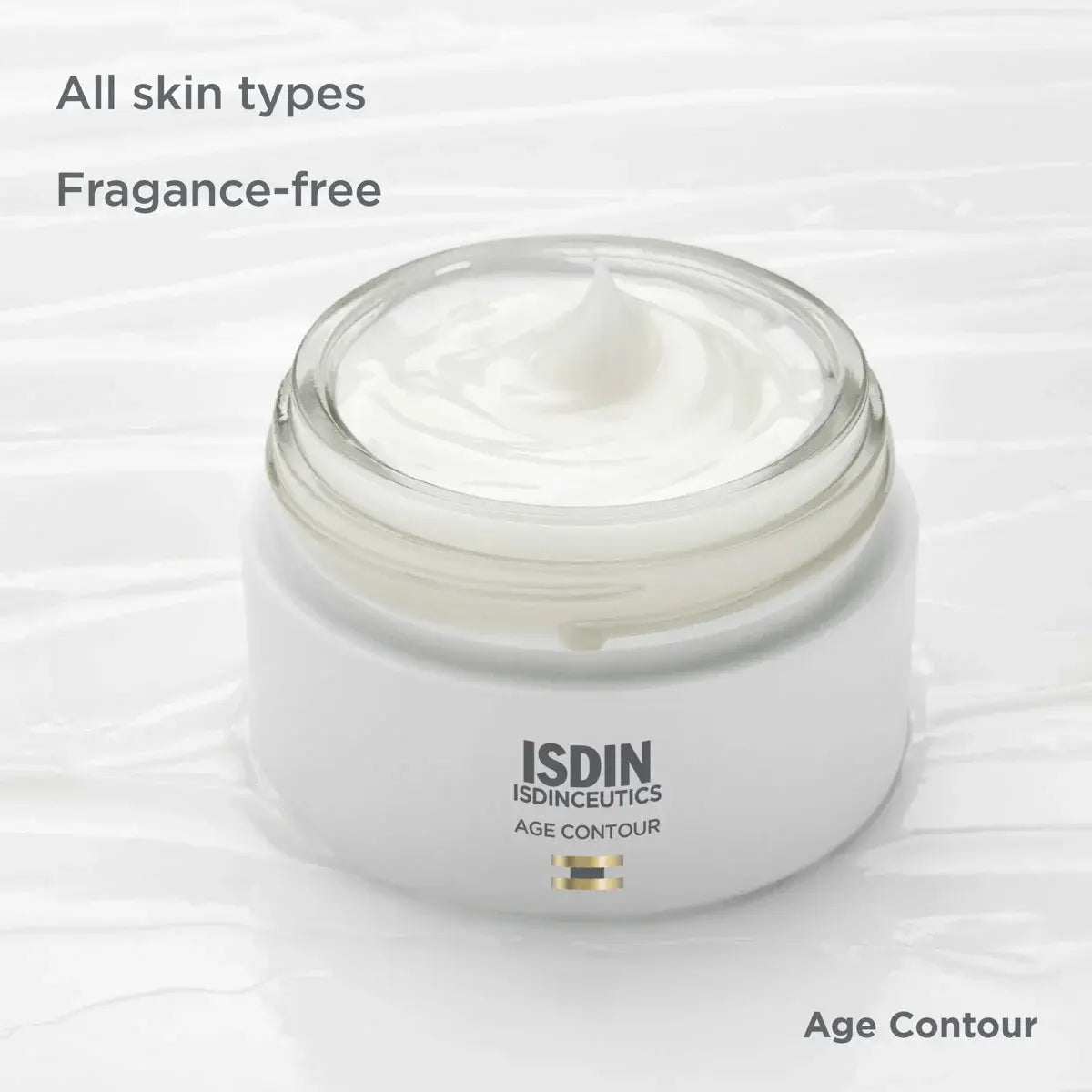 White canister of fragrance-free ISDINCEUTICS Age Contour for all skin types over a white, cream-textured background.