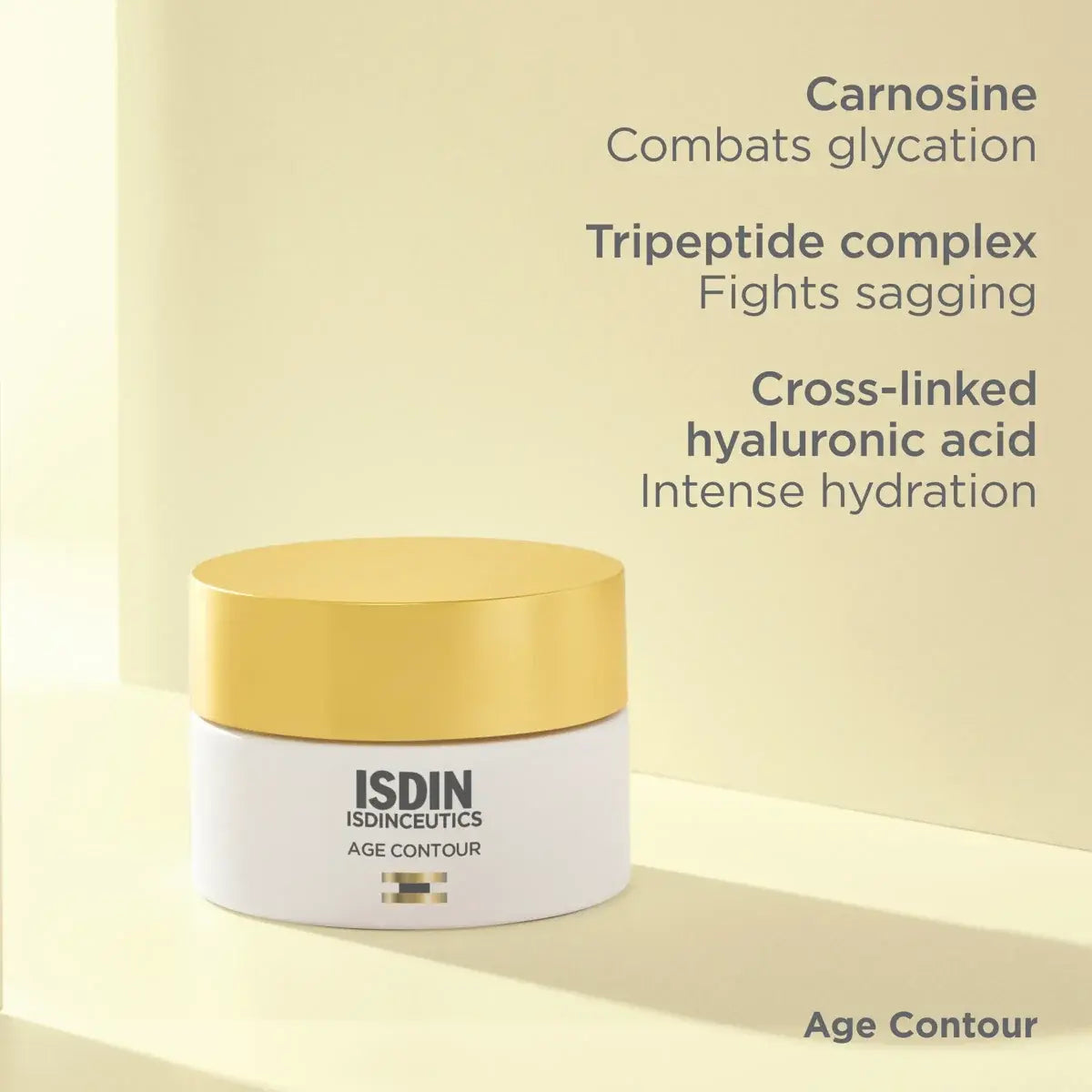 White canister of ISDINCEUTICS Age Contour against a pale yellow background with carnosine to combat glycation, tripeptide complex to fight sagging, and cross-linked hyaluronic acid for intense hydration. 