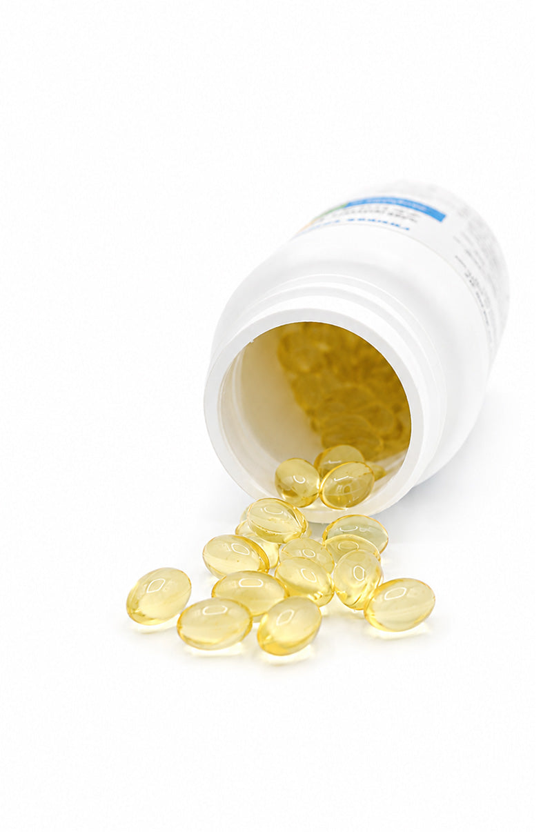 Open white Cooper Complete Vitamin D3 25 mcg (1000 IU) Supplement pill bottle with softgels spilling out on a white background