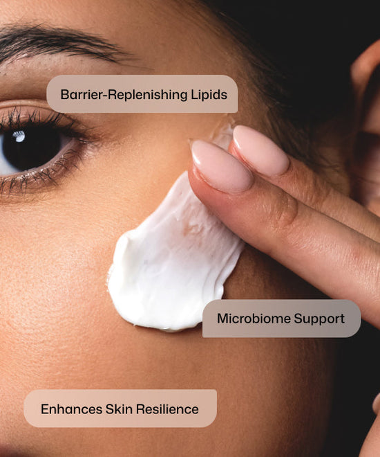 Close up of woman with healthy skin applying Revision Skincare DermProtect Barrier Defense with barrier-replenishing lipids and microbiome support to enhance skin resilience. 