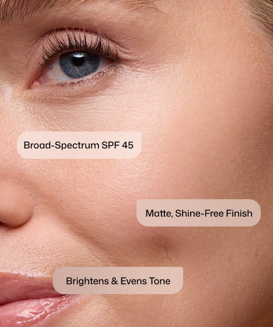 Close up of woman using Revision Skincare Intellishade Matte SPF Broad-Spectrum SPF 45 with a matte, shine-free finish to brighten and even tone. 
