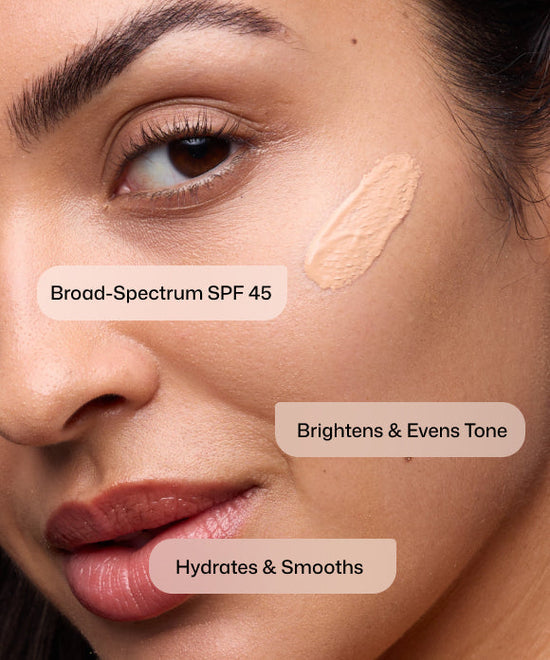 Close up of woman using Revision Skincare Intellishade Original Broad-Spectrum SPF 45 to brighten and even tone and hydrate and smooth skin. 