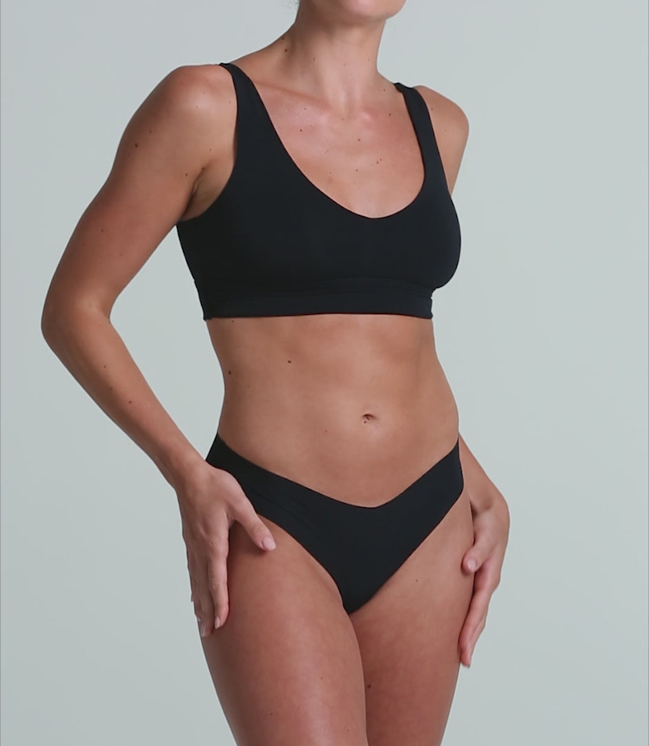 Video of the black Commando Classic Thong on a model, showing the seamless fit and raw-cut edges.