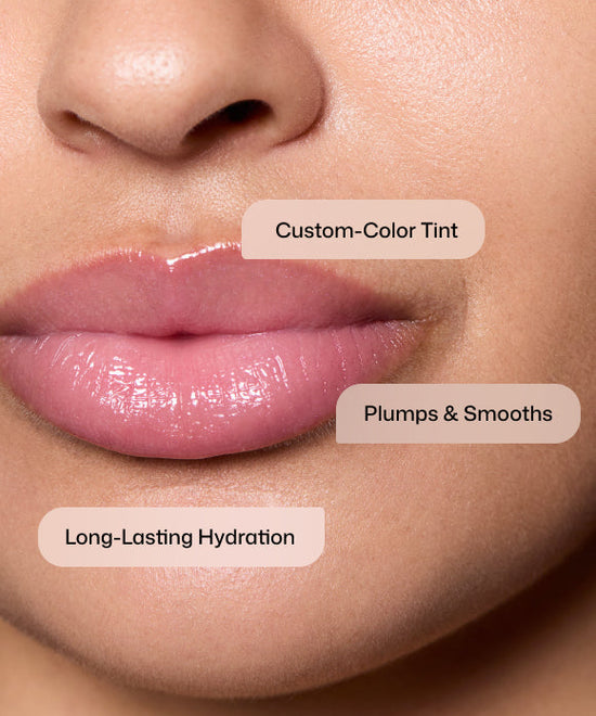 Close up of woman wearing Revision Skincare Tinted YouthFull Lip Replenisher with custom-color tint to plump and smooth with long-lasting hydration. 